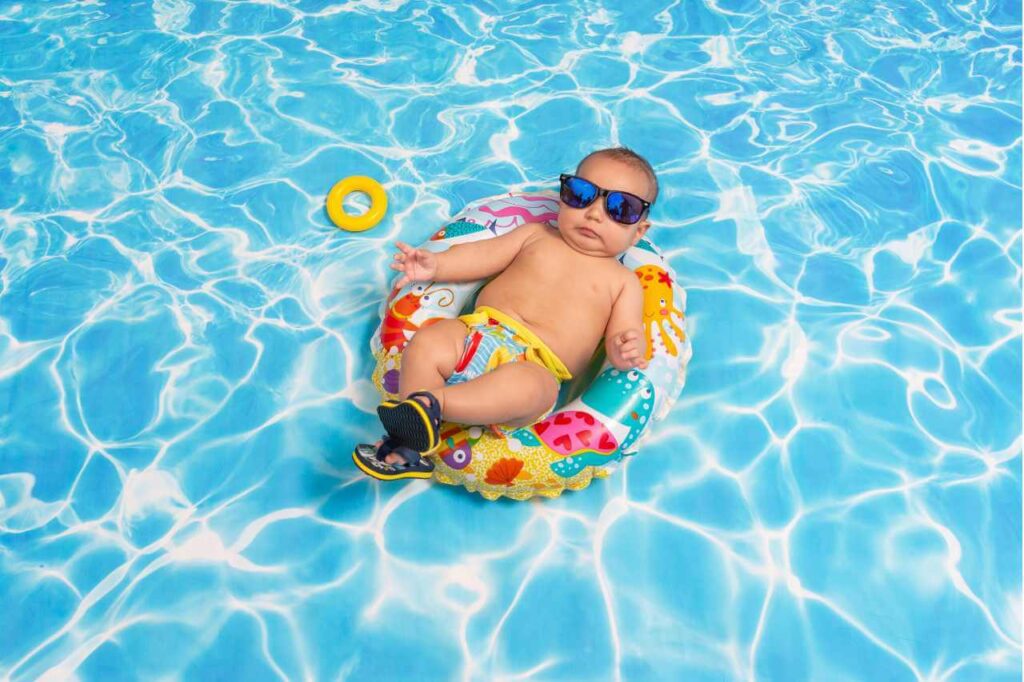 baby floating in plunge pool