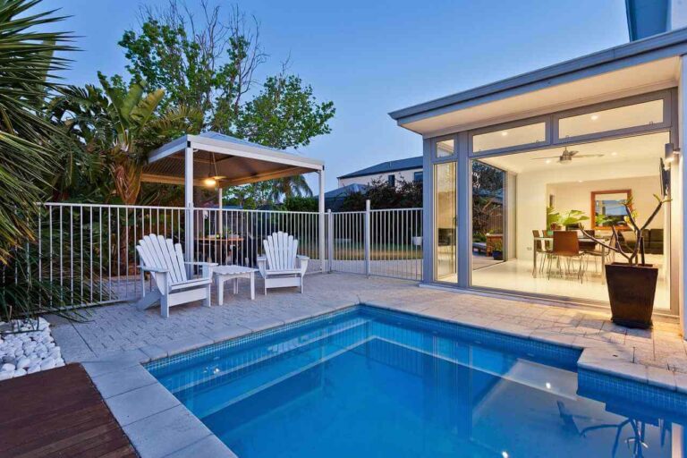 modern backyard plunge pool with outdoor seating and patio