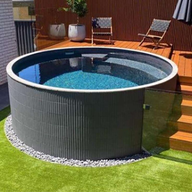 Round above ground plunge pool with ribbed exterior beside a timber deck and outdoor seating area in a modern backyard in Newcastle NSW