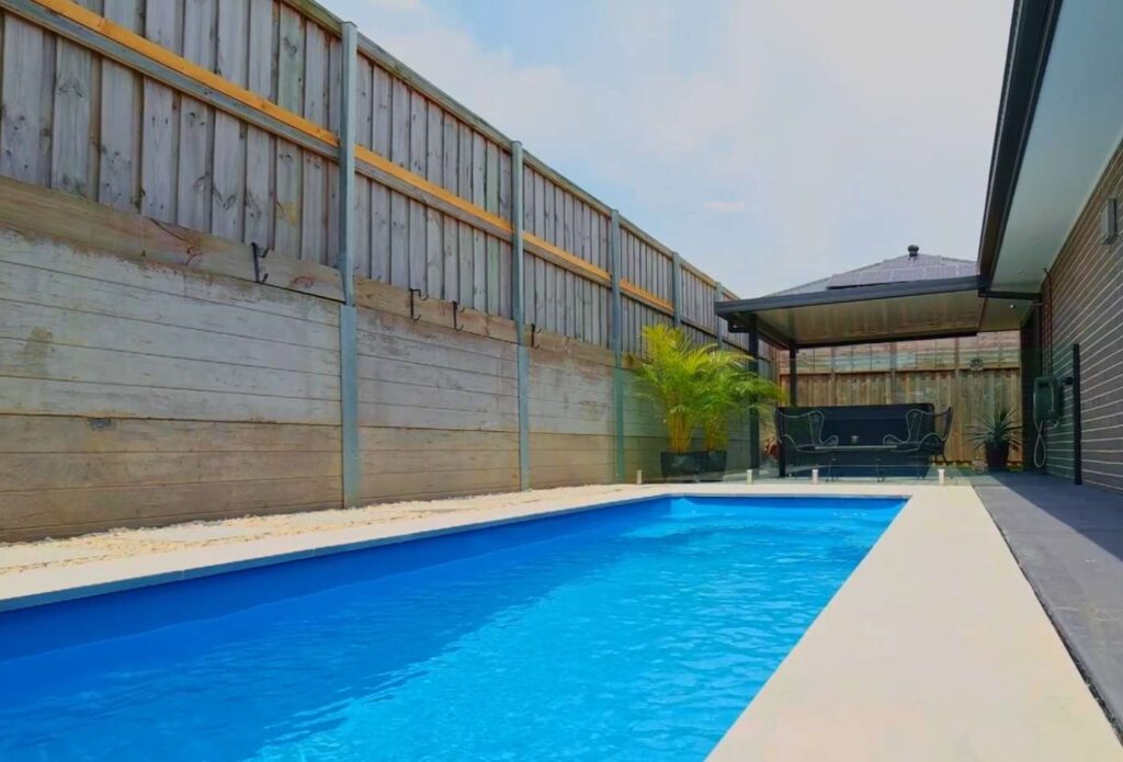 Compact 5.9m fibreglass pool design for a narrow backyard property in Bateau Bay NSW