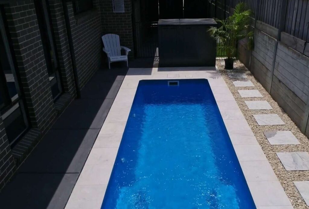 Overhead view of a compact fibreglass pool with modern landscaping in Bateau Bay