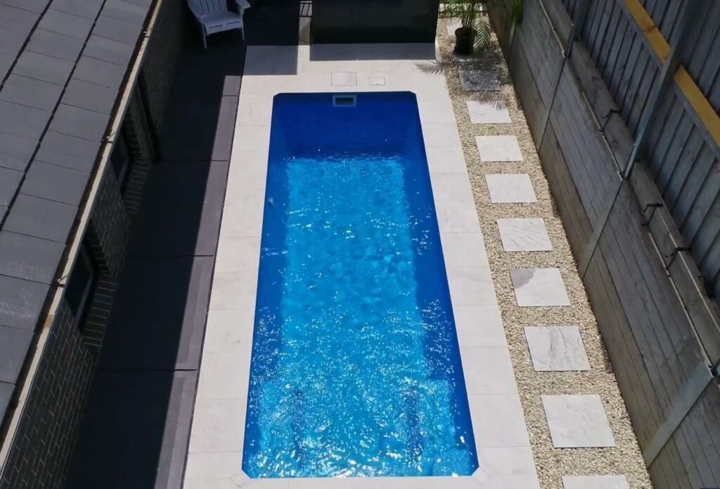 Family-friendly fibreglass pool installation for a small backyard space in Bateau Bay NSW